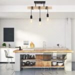Ceiling light with three bulbs above a kitchen island