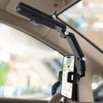 Phone holder mounted on a car sun visor