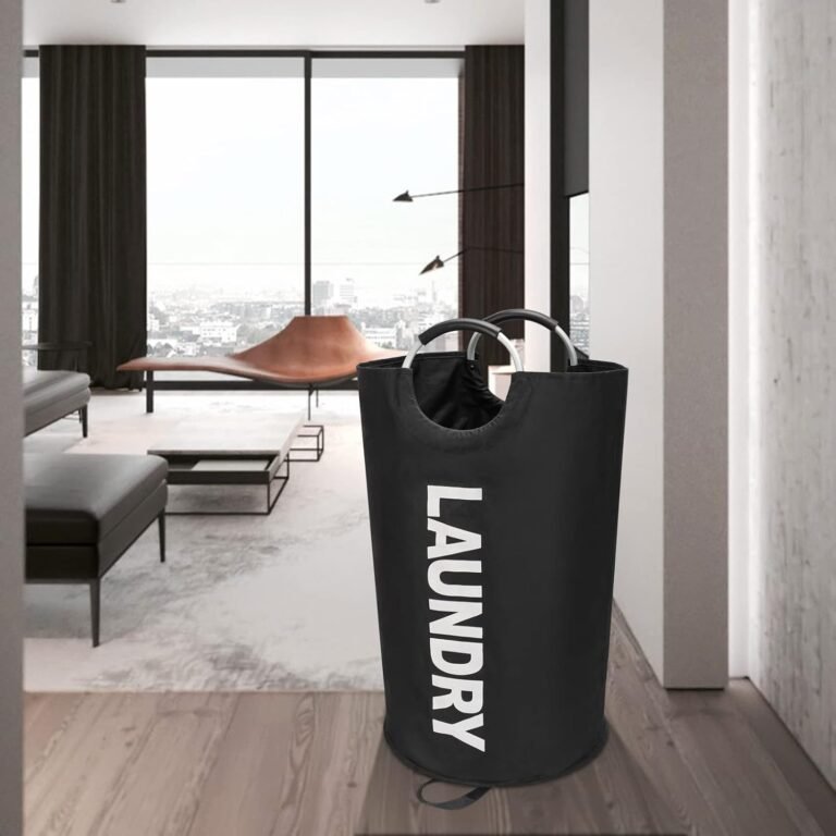 Black laundry bag with aluminium handles in a living room