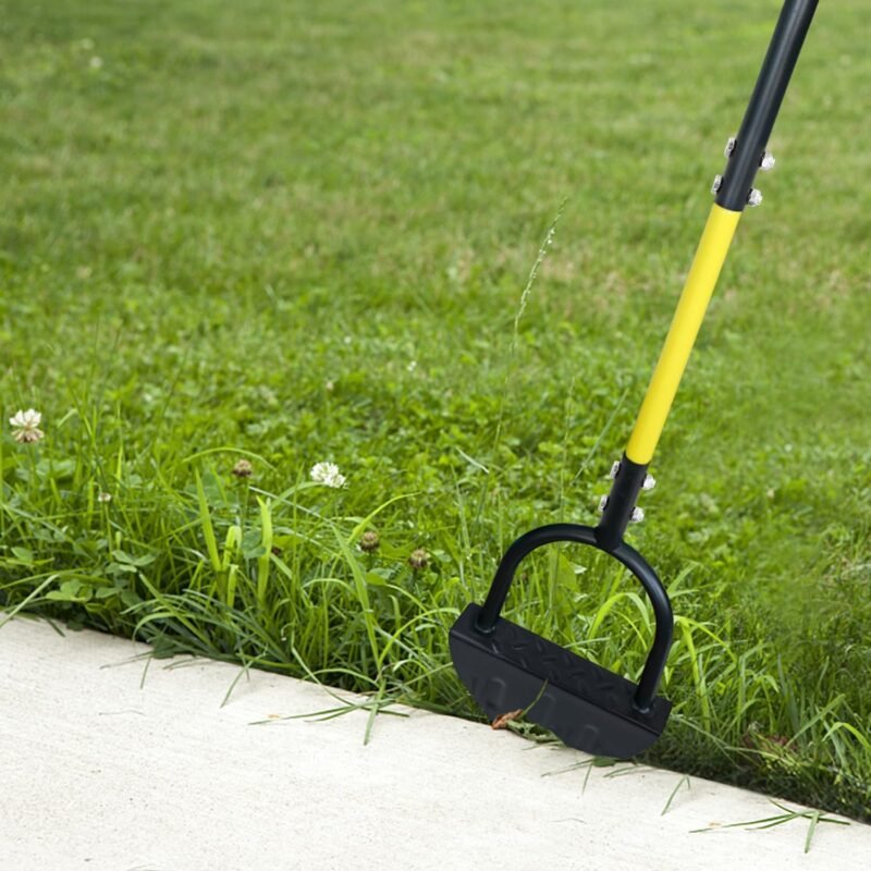 Half-moon lawn edger cutting along a path edge