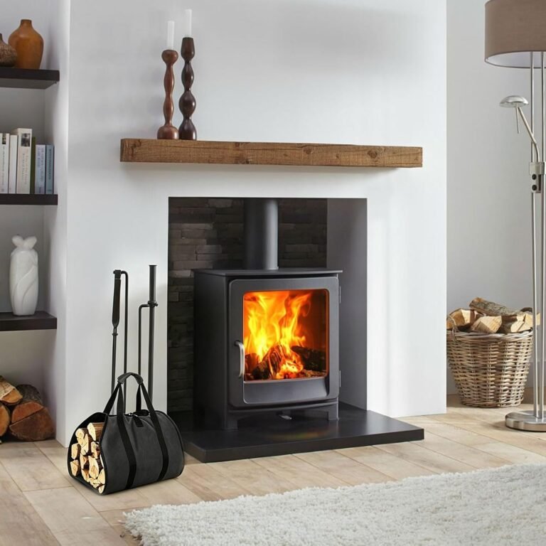 Black log carrier bag with firewood next to a wood-burning stove
