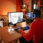 Clear acrylic controller stand on a gaming desk