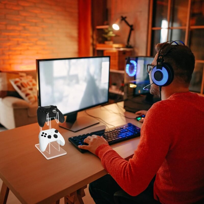 Clear acrylic controller stand on a gaming desk