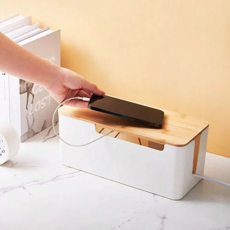 White cable management box with bamboo lid on a counter