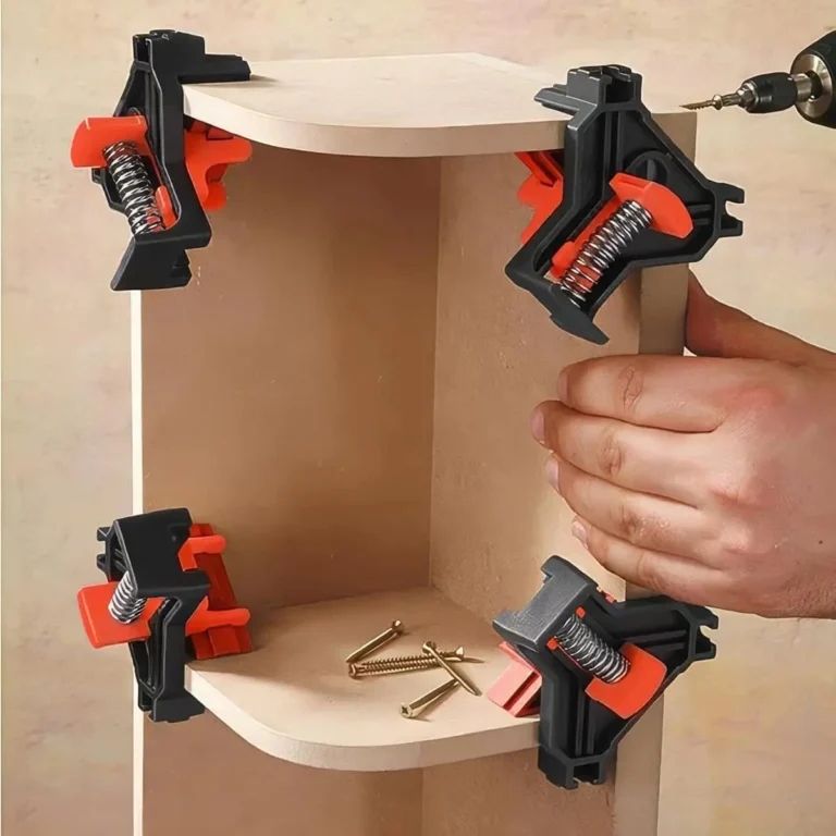 Orange 90-degree corner clamps holding a wooden shelf during assembly