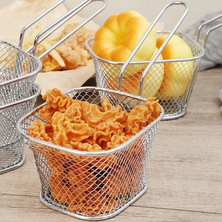 Square mesh chips basket filled with crisps on a wooden table