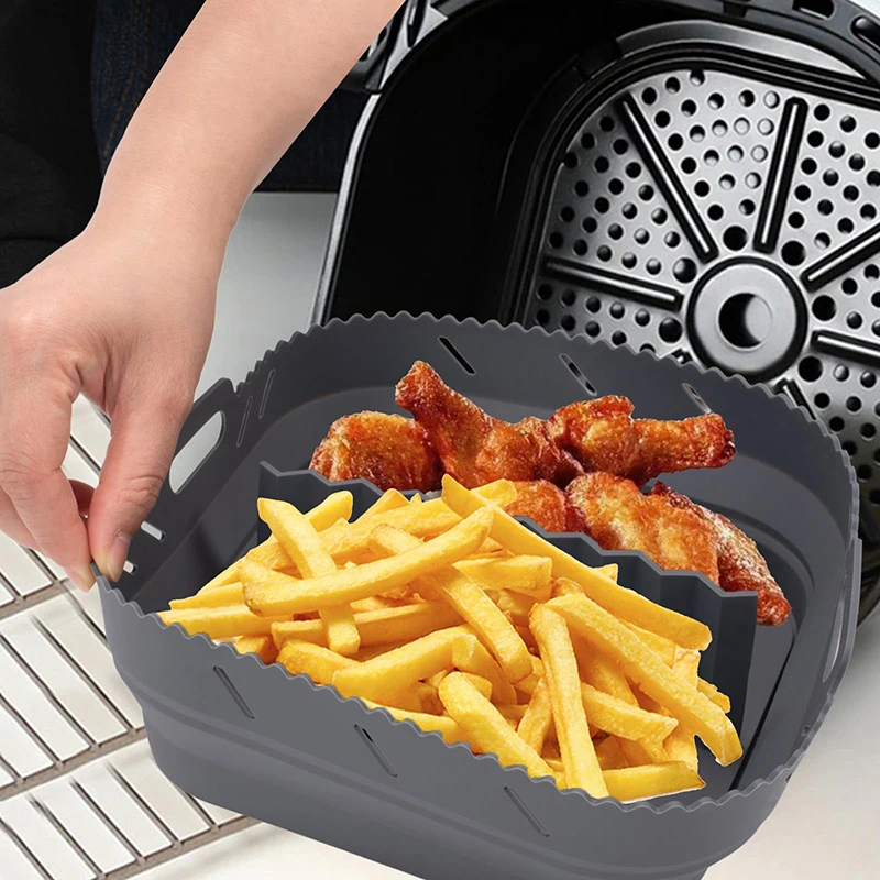 Square silicone air fryer liner with divider, holding chips and chicken wings