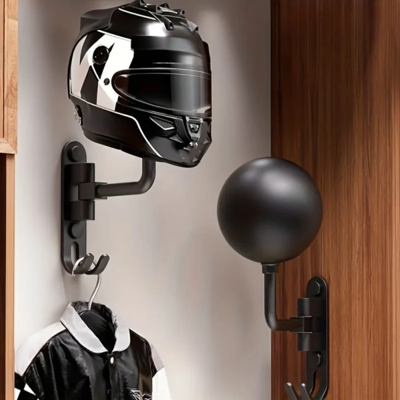Wall-mounted ball helmet holders with a motorcycle helmet and jacket hanging