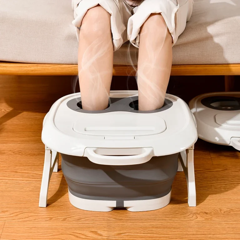 Feet soaking in the collapsible foot bath on a wooden floor in front of a sofa