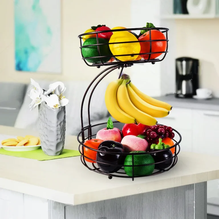 Two-tier fruit basket with banana hanger on a kitchen counter