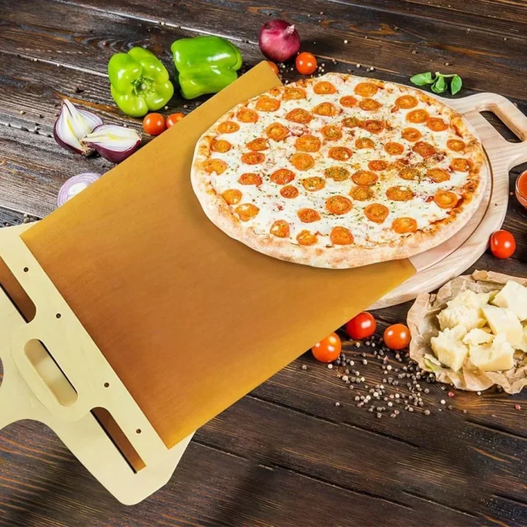 Sliding pizza peel with a pizza on a wooden kitchen table with fresh ingredients
