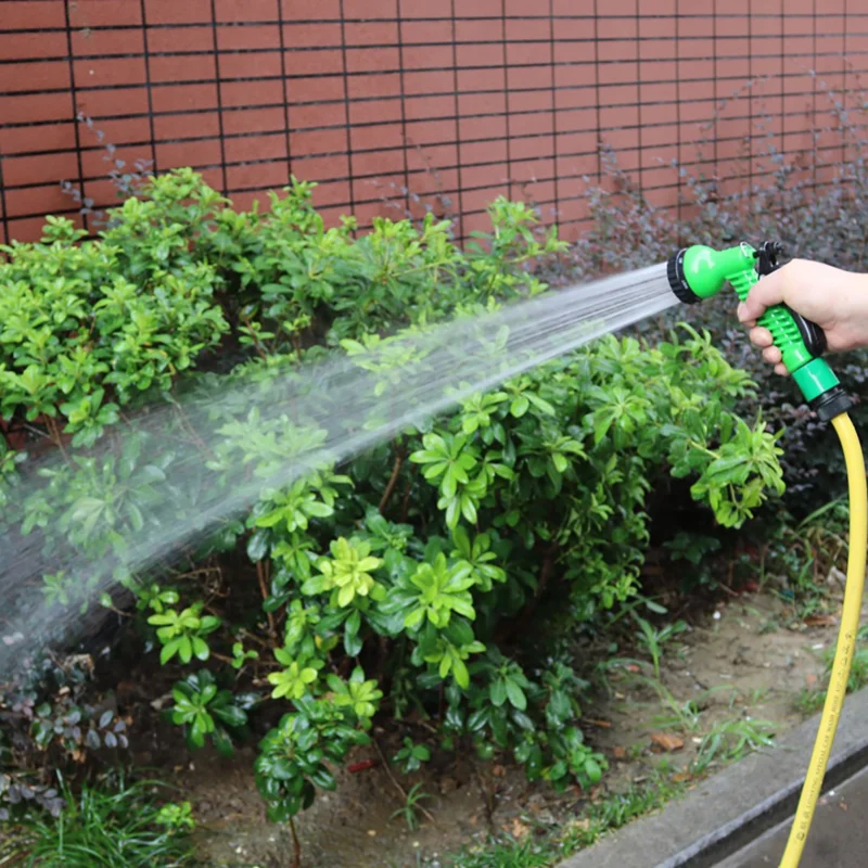 High Pressure Sprayer Green and Black in use at home