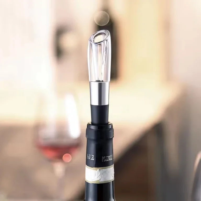 Wine aerator pourer in a wine bottle on a table