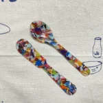 Confetti acrylic spoon and spreader on a tea towel