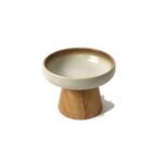 Ceramic cat bowl on wooden stand