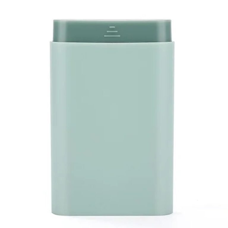 Small pill box with 6 compartments and pull-out drawer in mint green