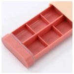 Pill box with pull-out drawer open showing 6 compartments