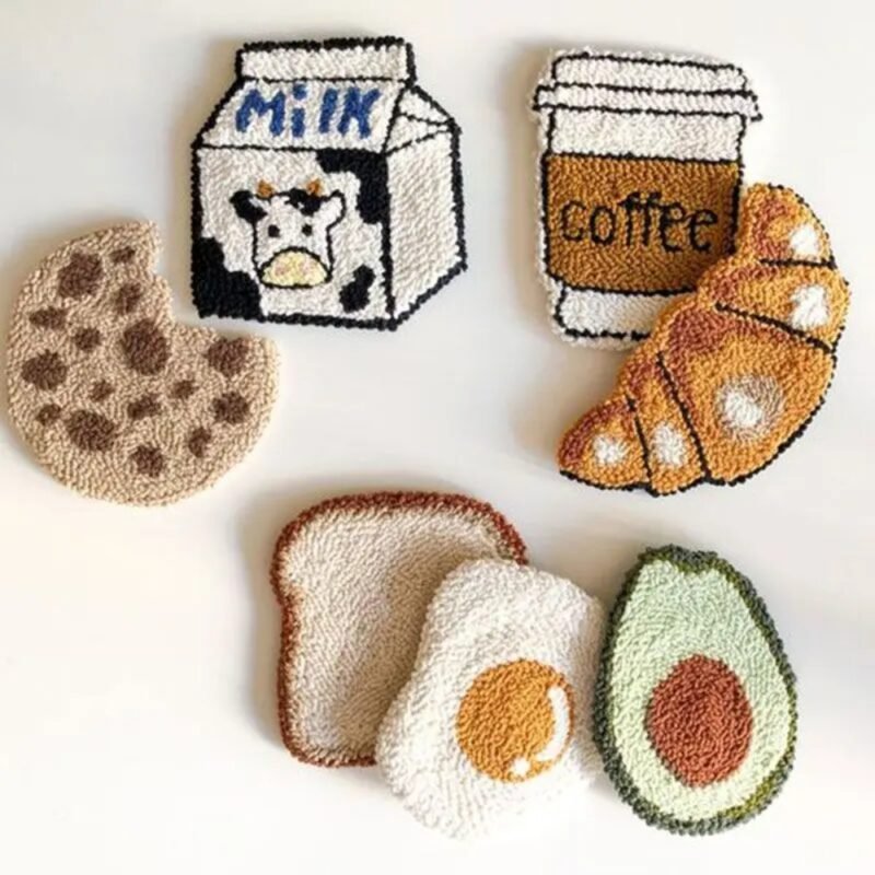 Finished punch needle coasters with food designs