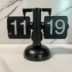 Black retro flip clock on marble table