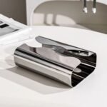 Stainless steel tissue holder on a table