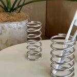 Spiral holders with toothbrushes