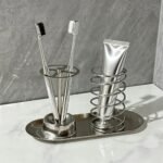 Toothbrush holder set with toothbrushes by the sink